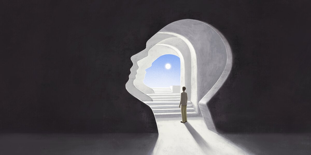 Person stepping through a doorway toward light — trauma healing and recovery